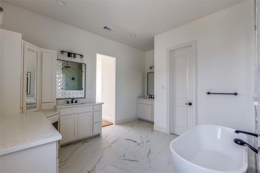 Bathroom with vanity and plus walk in shower