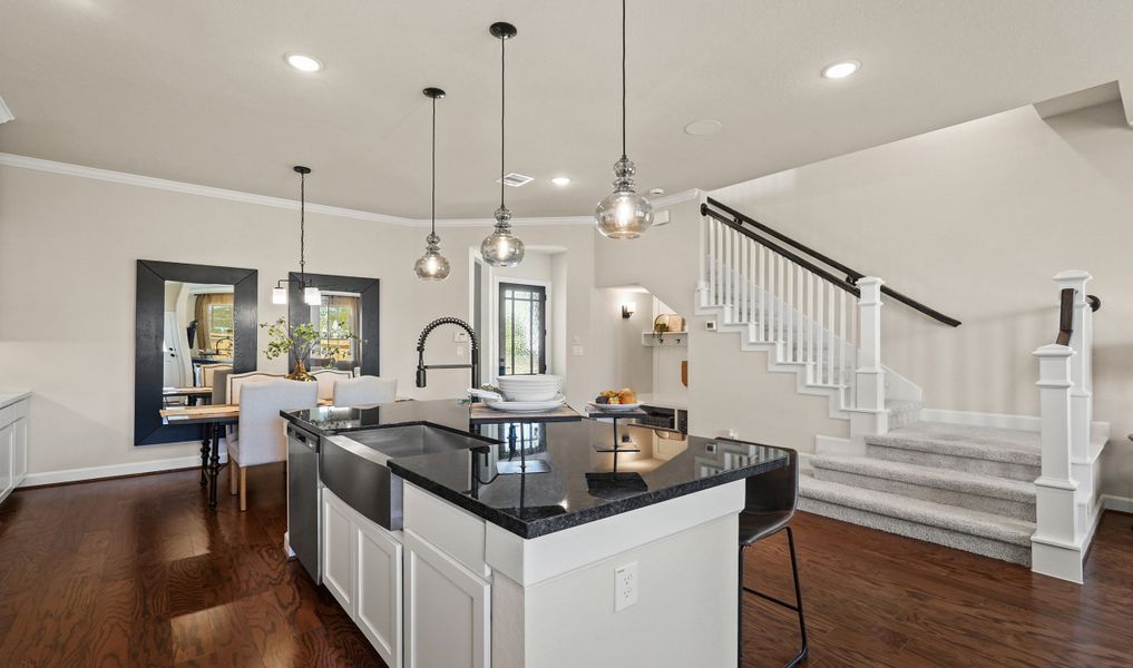 Gorgeous lighting in gourmet kitchen