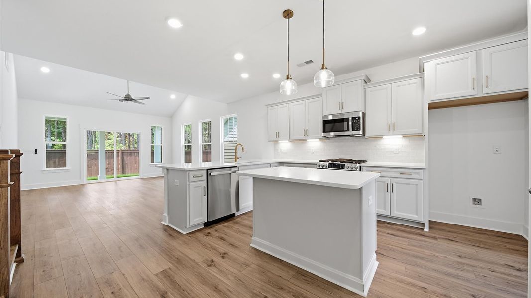 Accomplished design in a kitchen that blends function and form with a right-sized island Accomplished design in a kitchen that blends function and form with a right-sized island
