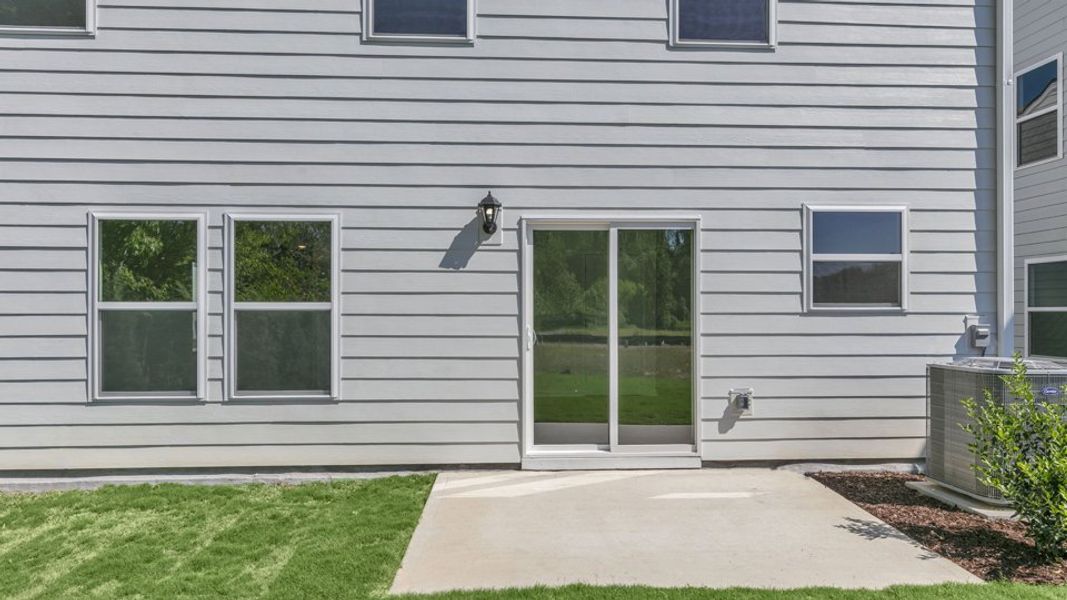 Representative exterior photo of a completed home built from the TAYLOR by D.R. Horton in Belle Grove, Wendell, NC (Image 19).