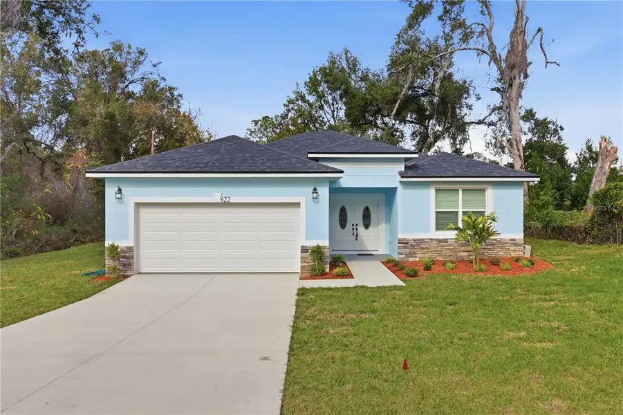 Front exterior of a new home in , Inverness, FL, highlighting curb appeal (Image 22).
