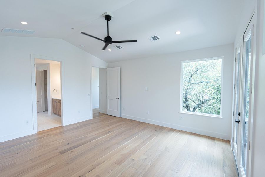 Oversized windows provides connection to nature. A well-lit bedroom provides ample space for relaxation with durable hardwood flooring and convenient ceiling fan. Oversized windows provides connection to nature. A well-lit bedroom provides ample space for relaxation with durable hardwood flooring and convenient ceiling fan.