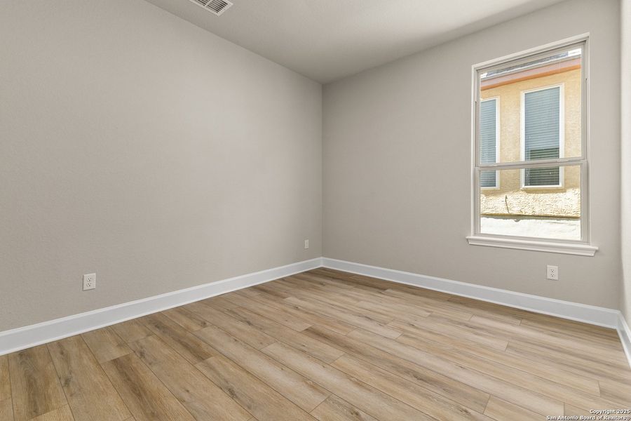Spacious, unfurnished interior of a new home in The Enclave at Potranco Oaks, Castroville (Image 32).