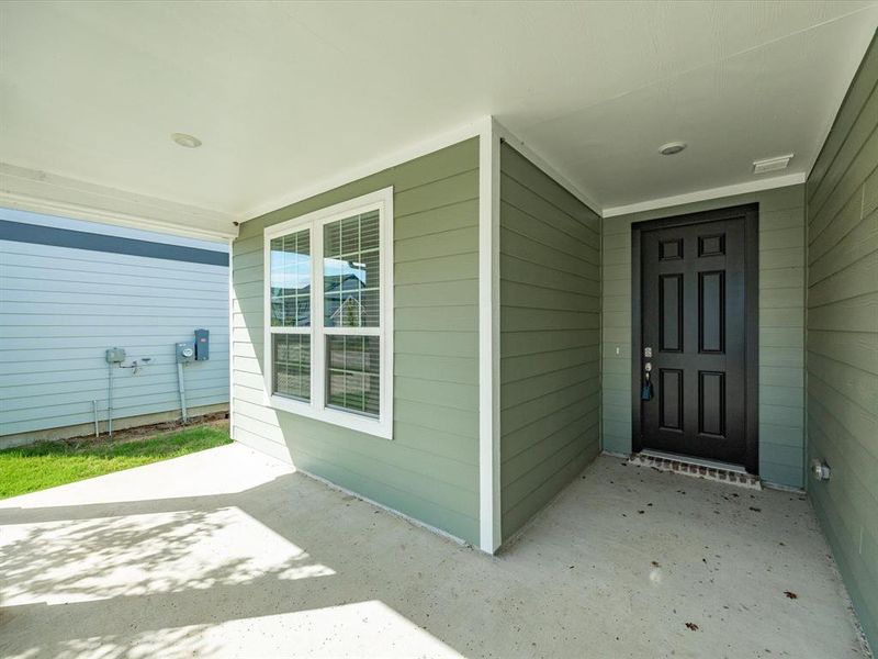 View of exterior entry with a patio View of exterior entry with a patio