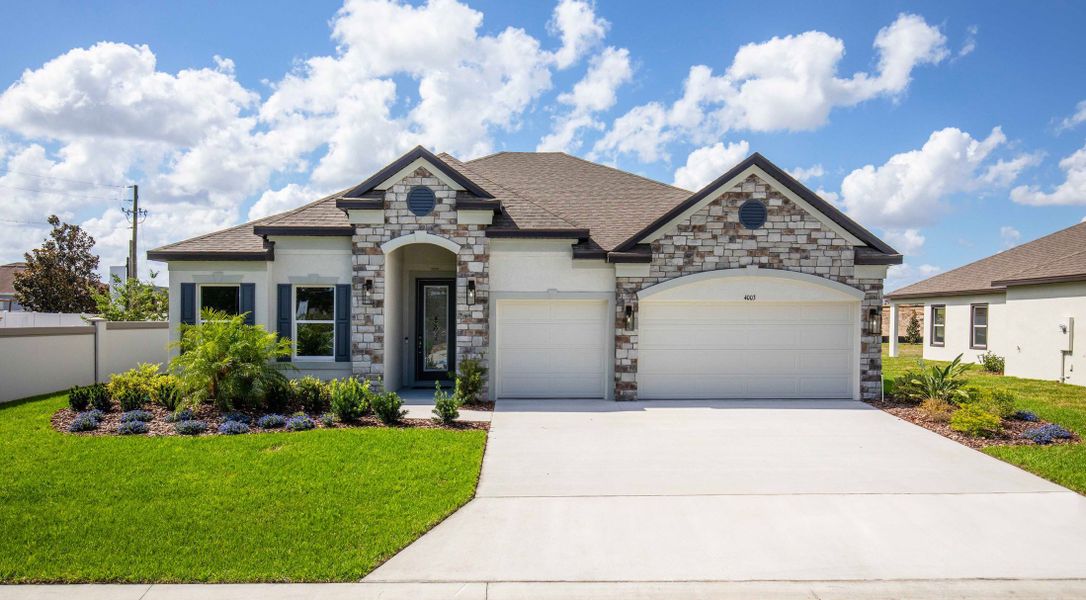 Representative exterior photo of a completed home built from the Sienna by Maronda Homes in Applewood Reserve, Lakeland, FL (Image 24). Representative exterior photo of a completed home built from the Sienna by Maronda Homes in Applewood Reserve, Lakeland, FL (Image 24).