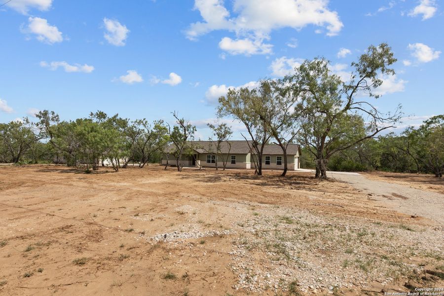 Front exterior of a new home in , Pleasanton, TX, highlighting curb appeal (Image 1). Front exterior of a new home in , Pleasanton, TX, highlighting curb appeal (Image 1).
