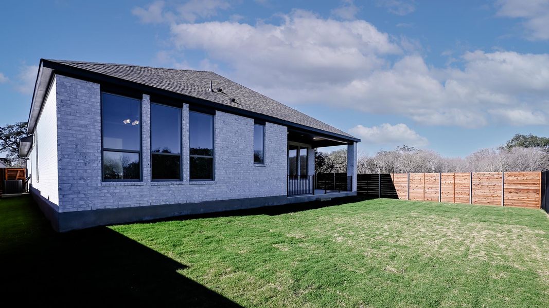 Exterior details and patio area of a home in Juniper Springs, Lockhart (Image 18).