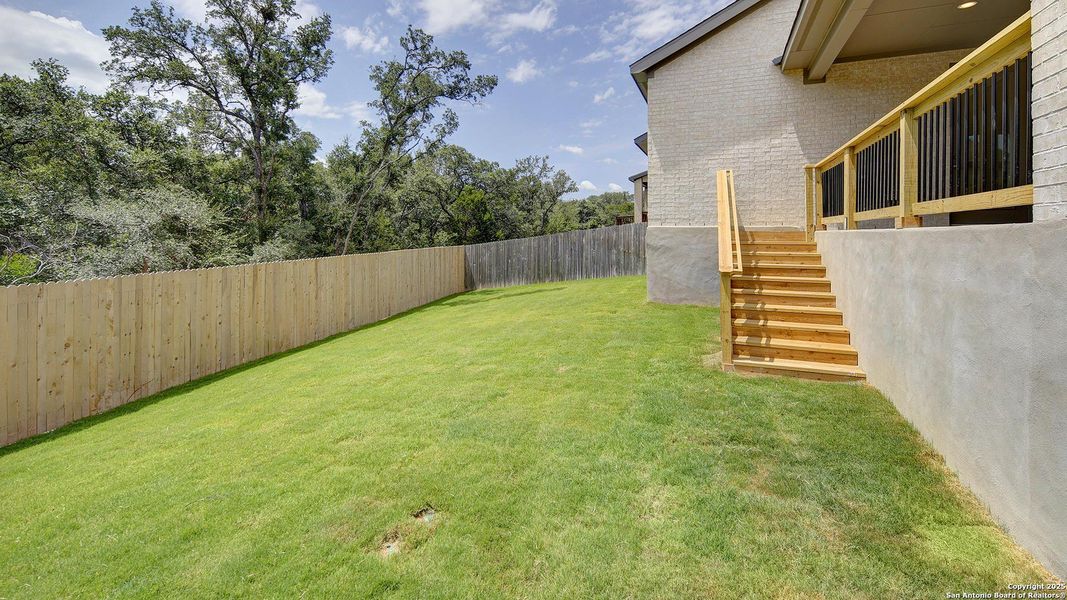 Front exterior of a new home in Stevens Ranch 55', San Antonio, TX, highlighting curb appeal (Image 22).