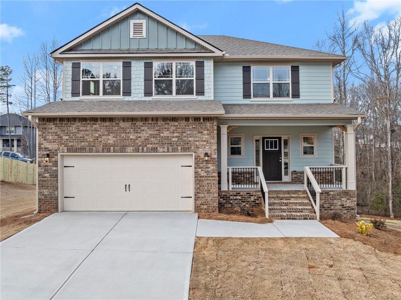 Front exterior of a new home in Magnolia Villas, Cornelia, GA, highlighting curb appeal (Image 2).