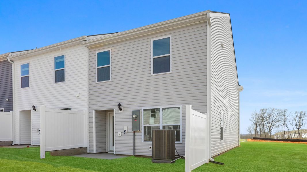 Exterior details and patio area of a home in Chestnut Ridge Townhomes, Greenville (Image 3).