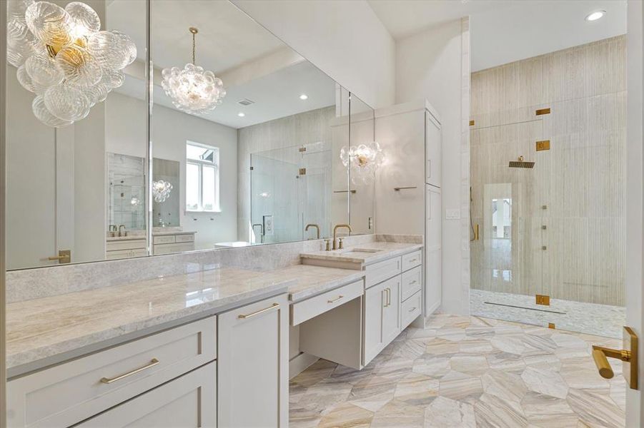 Full bath with a tile shower, vanity, a chandelier, and recessed lighting