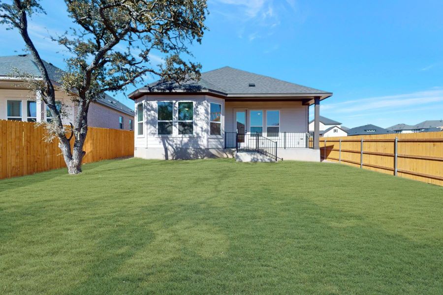 Exterior details and patio area of a home in Heritage, Dripping Springs (Image 18).