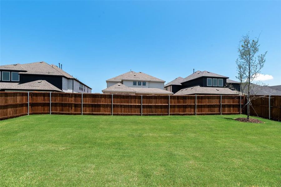 Front exterior of a new home in Valencia On The Lake, Little Elm, TX, highlighting curb appeal (Image 18).