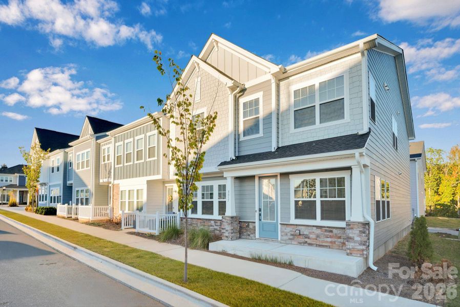 Front exterior of a new home in Trellis at The Commons, Charlotte, NC, highlighting curb appeal (Image 2). Front exterior of a new home in Trellis at The Commons, Charlotte, NC, highlighting curb appeal (Image 2).