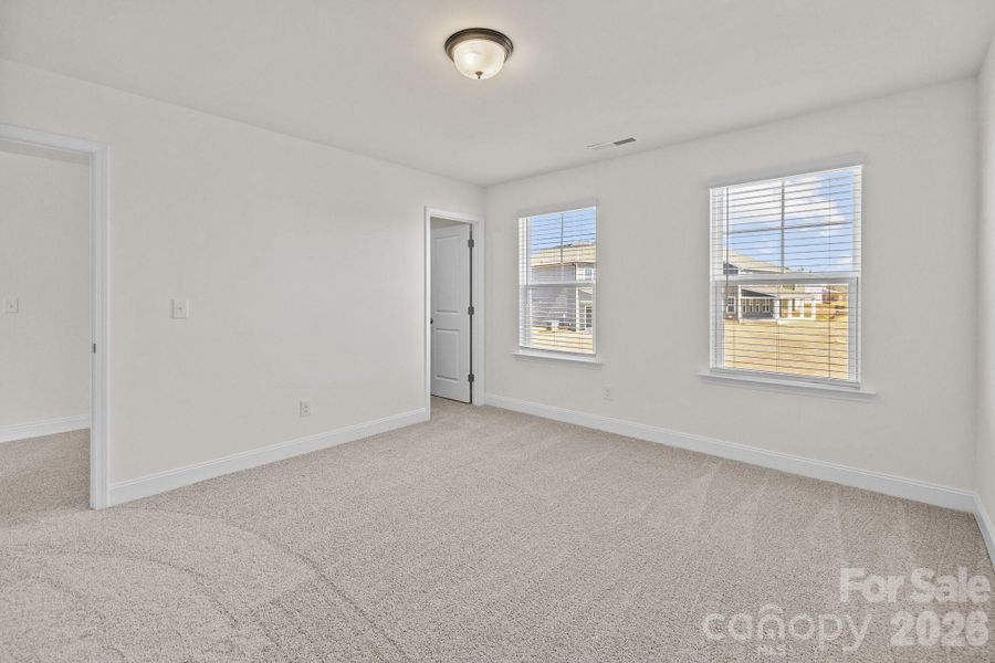 Secondary BedroomPhotos are representative and may not reflect the exact home, finishes, or features.