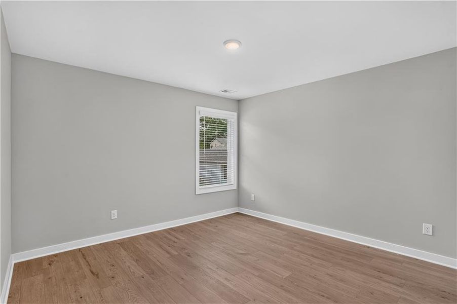 Spacious, unfurnished interior of a new home in The Cottages at East Lanier, Fayetteville (Image 13).