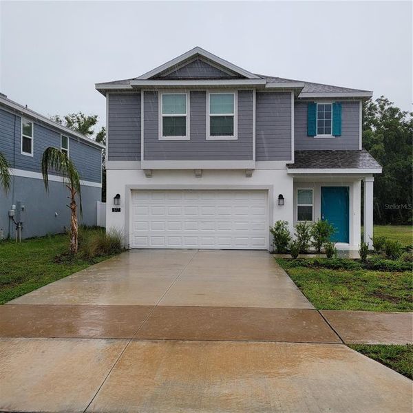 Front exterior of a new home in , Lake Wales, FL, highlighting curb appeal (Image 1). Front exterior of a new home in , Lake Wales, FL, highlighting curb appeal (Image 1).