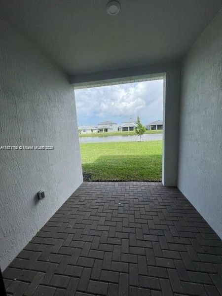 Exterior details and patio area of a home in Tradition - Cadence - Townhomes, Port St. Lucie (Image 2).