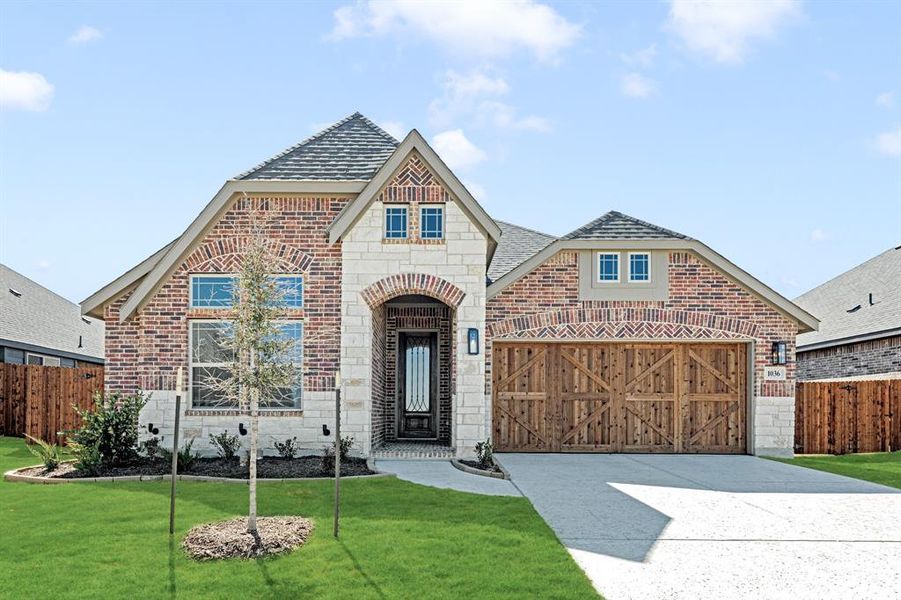 Front exterior of a new home in The Oaks, Red Oak, TX, highlighting curb appeal (Image 1).