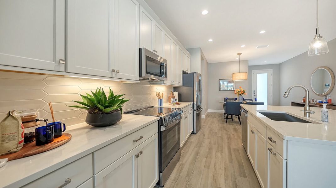 Representative furnished interior of a home built from the Avery by Neal Communities in SkySail, Naples (Image 14).