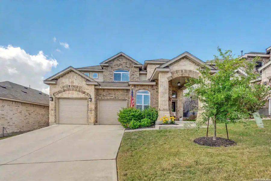 Front exterior of a new home in Comanche Ridge, San Antonio, TX, highlighting curb appeal (Image 1). Front exterior of a new home in Comanche Ridge, San Antonio, TX, highlighting curb appeal (Image 1).
