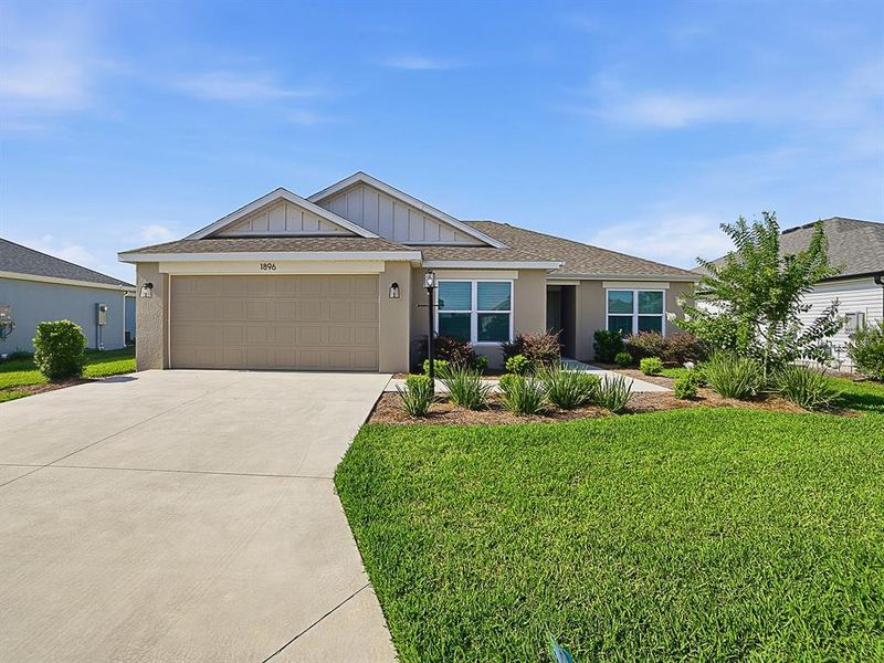 Front exterior of a new home in , The Villages, FL, highlighting curb appeal (Image 2). Front exterior of a new home in , The Villages, FL, highlighting curb appeal (Image 2).