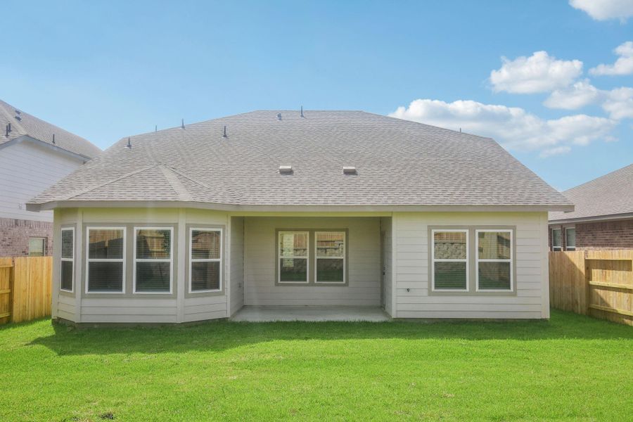 Front exterior of a new home in Pine Lake Cove - Classic Series, Montgomery, TX, highlighting curb appeal (Image 9). Front exterior of a new home in Pine Lake Cove - Classic Series, Montgomery, TX, highlighting curb appeal (Image 9).
