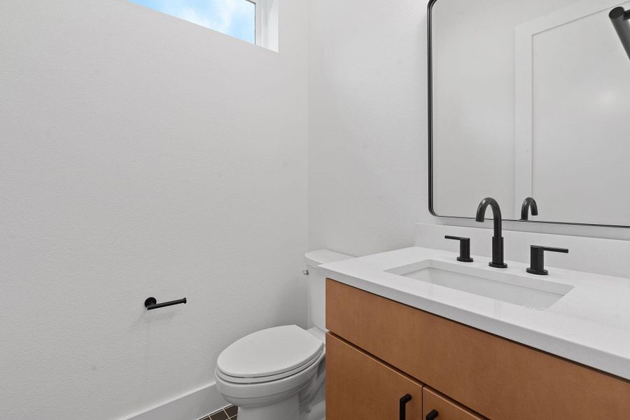 Half bath with vanity and toilet Half bath with vanity and toilet