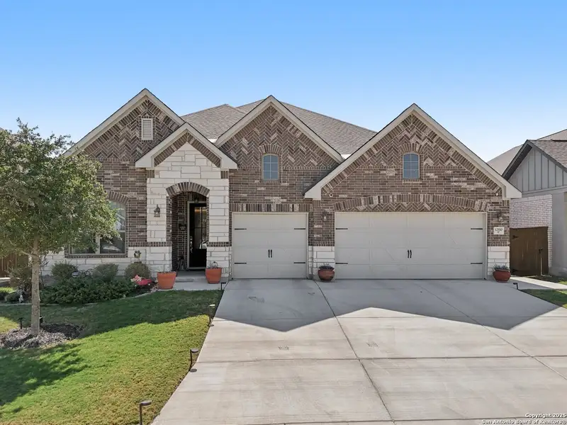 Front exterior of a new home in Stillwater Ranch, San Antonio, TX, highlighting curb appeal (Image 2).