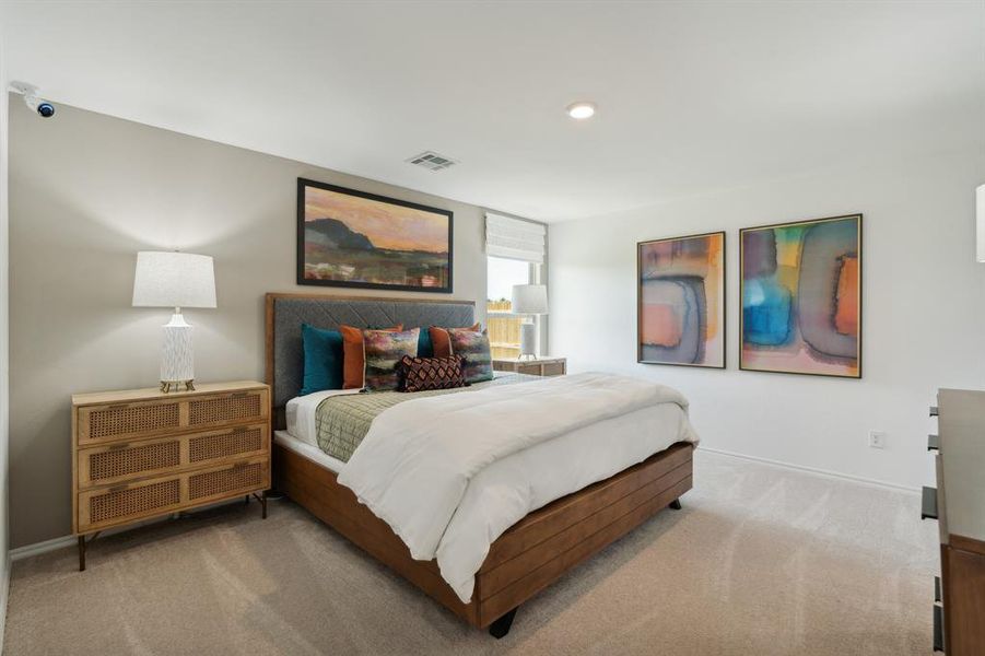 Bedroom with light colored carpet