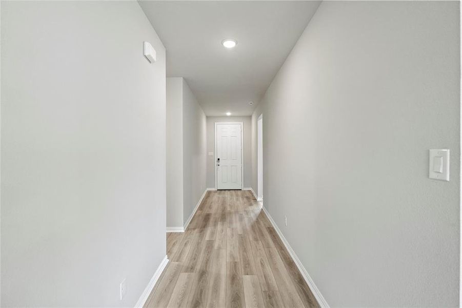 Hallway featuring light hardwood / wood-style flooring