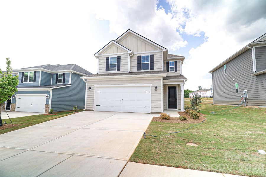 Front exterior of a new home in , Denver, NC, highlighting curb appeal (Image 23).