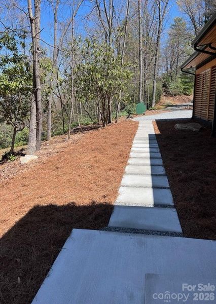 A walkway of cement pavers has been added for guests to enter in