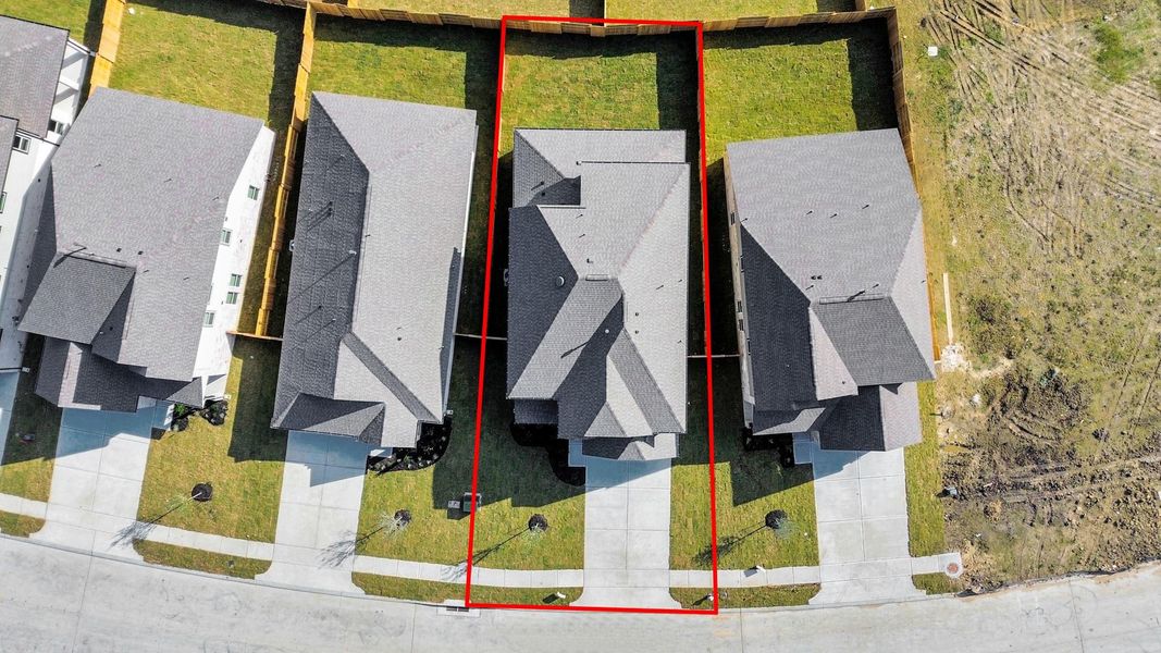 An aerial view of a spacious subdivision lot, highlighting a well-maintained yard and a fully fenced perimeter, offering both privacy andexpansive outdoor space. An aerial view of a spacious subdivision lot, highlighting a well-maintained yard and a fully fenced perimeter, offering both privacy andexpansive outdoor space.