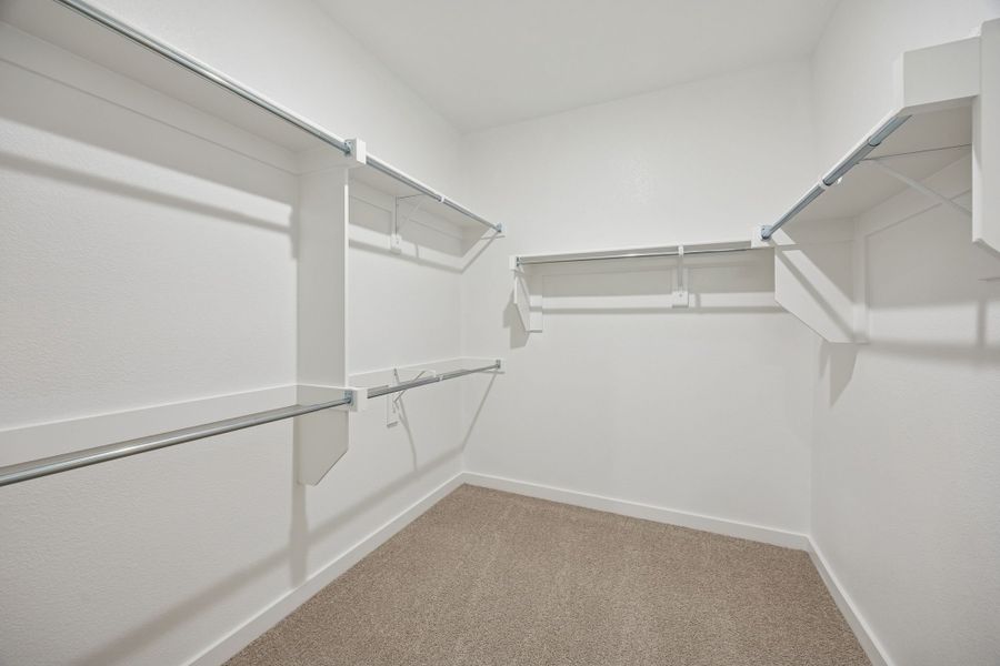 Primary Closet in the Masters home plan by Trophy Signature Homes – REPRESENTATIVE PHOTO