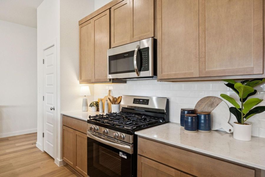 Kitchen in the Diamond home plan by Trophy Signature Homes – REPRESENTATIVE PHOTO