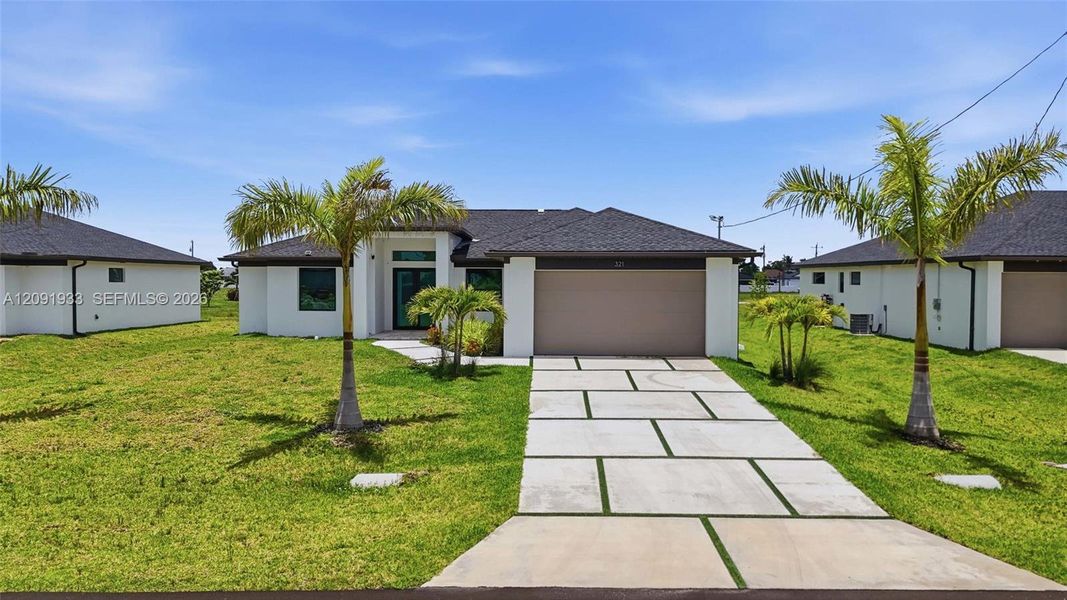 Front exterior of a new home in , Cape Coral, FL, highlighting curb appeal (Image 2). Front exterior of a new home in , Cape Coral, FL, highlighting curb appeal (Image 2).