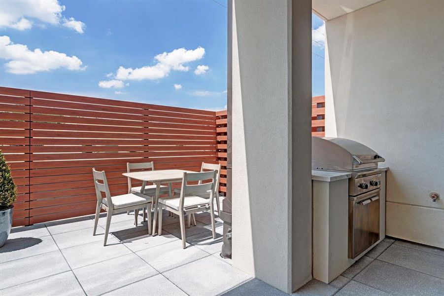 Residents enjoy access to the lounge and terrace with boasts useful amenities like a gas grill, fire pit, and casual seating areas.