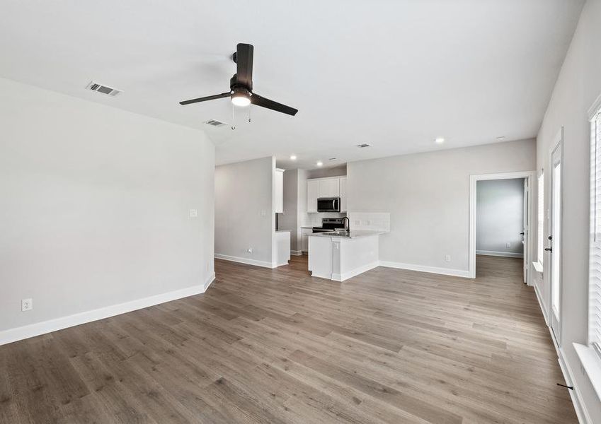 The family room sits right off of the dining room and kitchen. The family room sits right off of the dining room and kitchen.