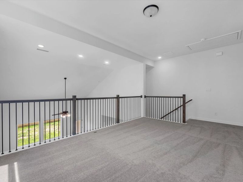 Upstairs loft. Sample product photo. Actual exterior and interior selections may vary by homesite. Photo may be virtually staged.