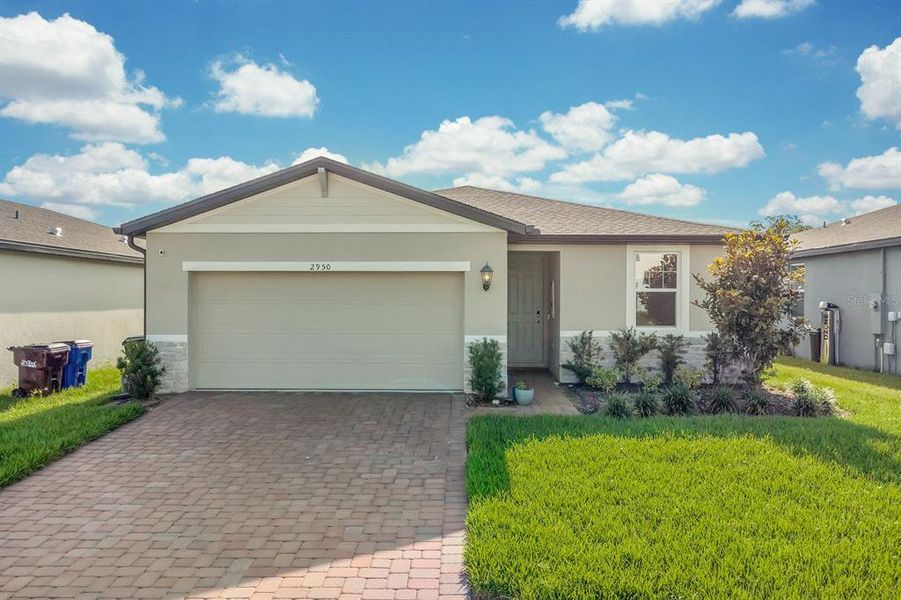 Front exterior of a new home in The Reserve at Twin Lakes, St. Cloud, FL, highlighting curb appeal (Image 2). Front exterior of a new home in The Reserve at Twin Lakes, St. Cloud, FL, highlighting curb appeal (Image 2).