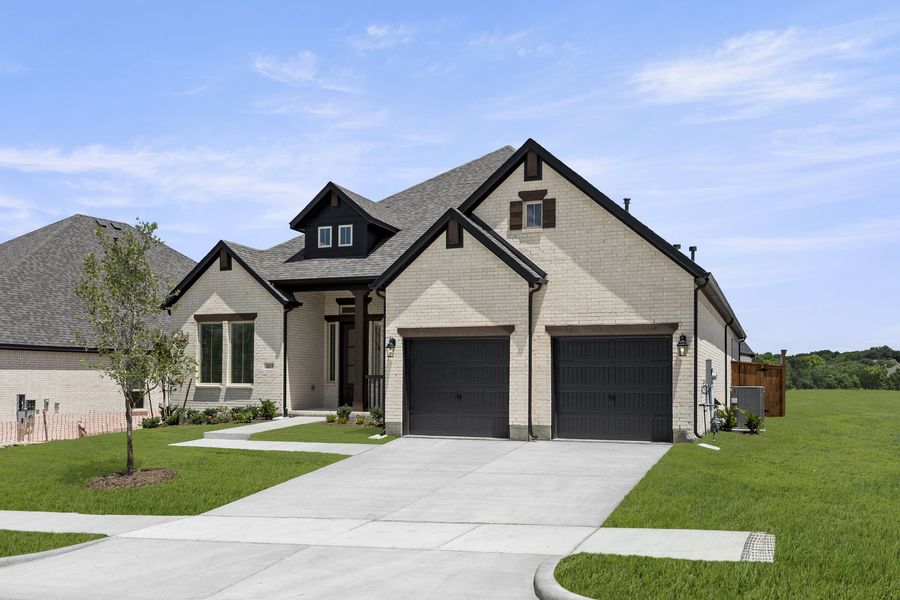 Front exterior of a new home in Providence Cove, McKinney, TX, highlighting curb appeal (Image 2).