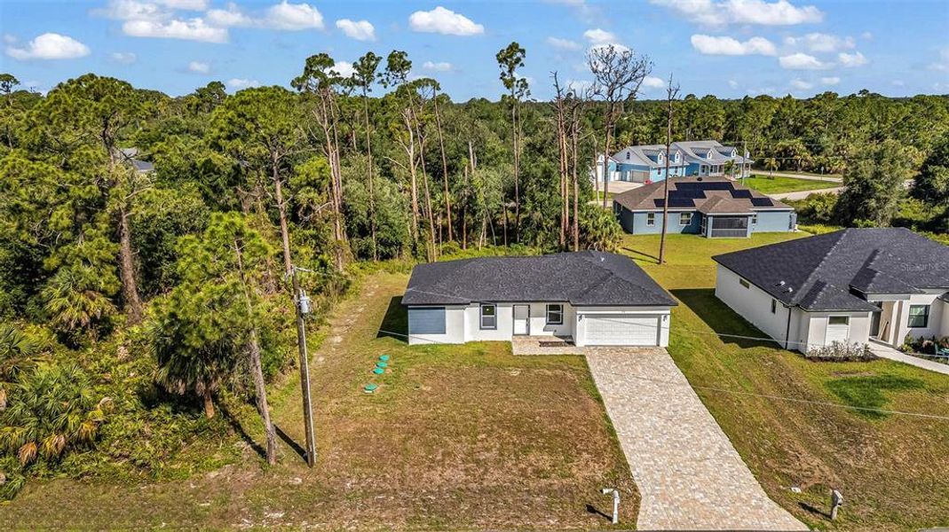 Front exterior of a new home in , Port Charlotte, FL, highlighting curb appeal (Image 1). Front exterior of a new home in , Port Charlotte, FL, highlighting curb appeal (Image 1).