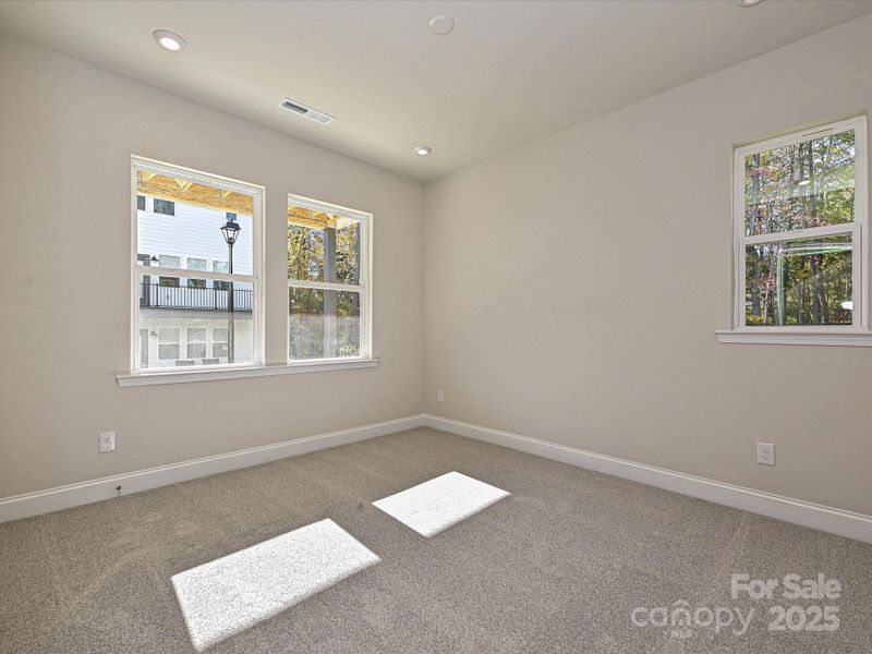 First Floor Guest Suite Facing First Floor Outdoor Living. First Floor Guest Suite Facing First Floor Outdoor Living.