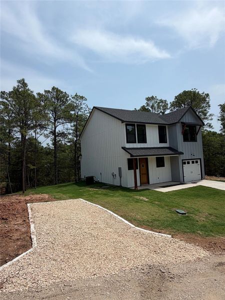 Freshly installed gravel driveway for additional parking.