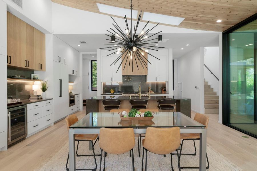 A luminous formal dining area is nestled at the heart of the main living area under a unique designer chandelier with space for a sizable dining table where you can host fabulous dinner parties.