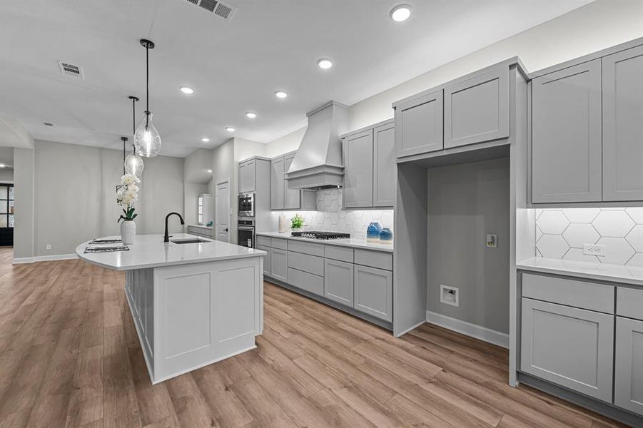 Lots of cabinets and storage in this beautiful Kitchen!