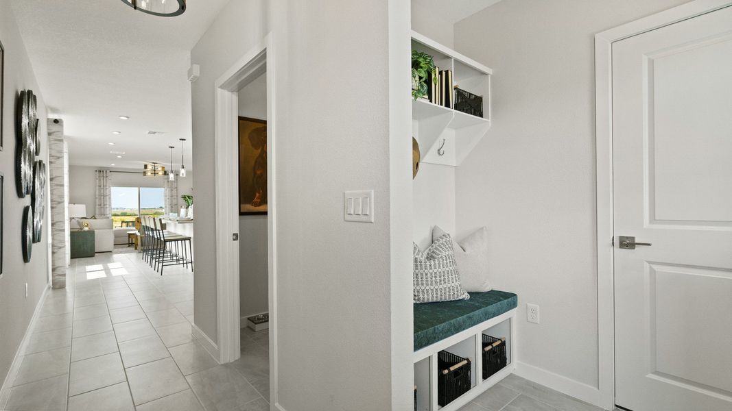 Stay organized with The Atlantic’s built-in drop zone, leading into an open hallway with sleek tile floors and modern touches
