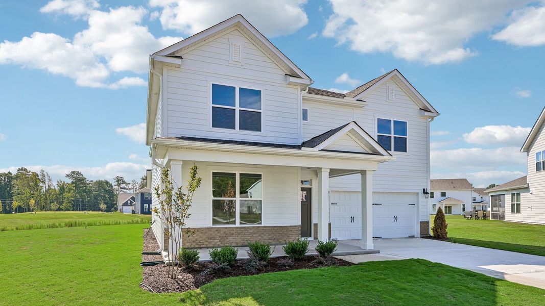 Front exterior of a new home in Eagle Creek, Fuquay Varina, NC, highlighting curb appeal (Image 17).