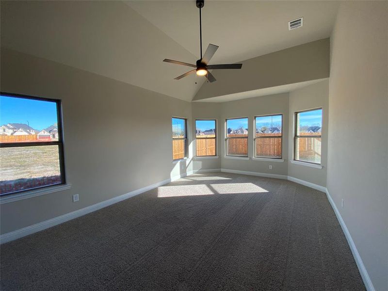 Master bedroom has bay window, vaulted ceilings, and a ceiling fan Master bedroom has bay window, vaulted ceilings, and a ceiling fan